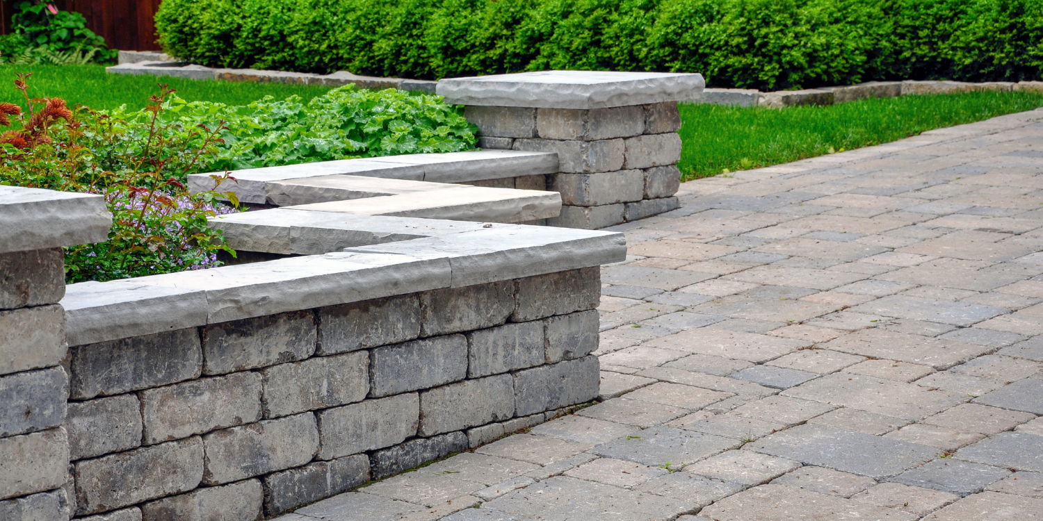 Retaining wall along driveway/walkway - Thinking of Building a Retaining Wall? Check Out This Comprehensive FAQ Guide